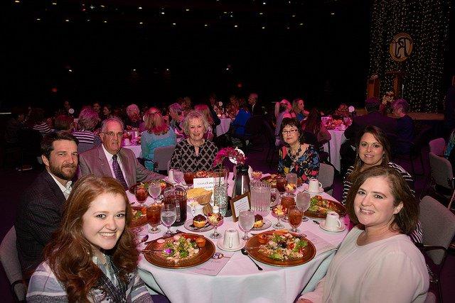 Photo of a table of alumni